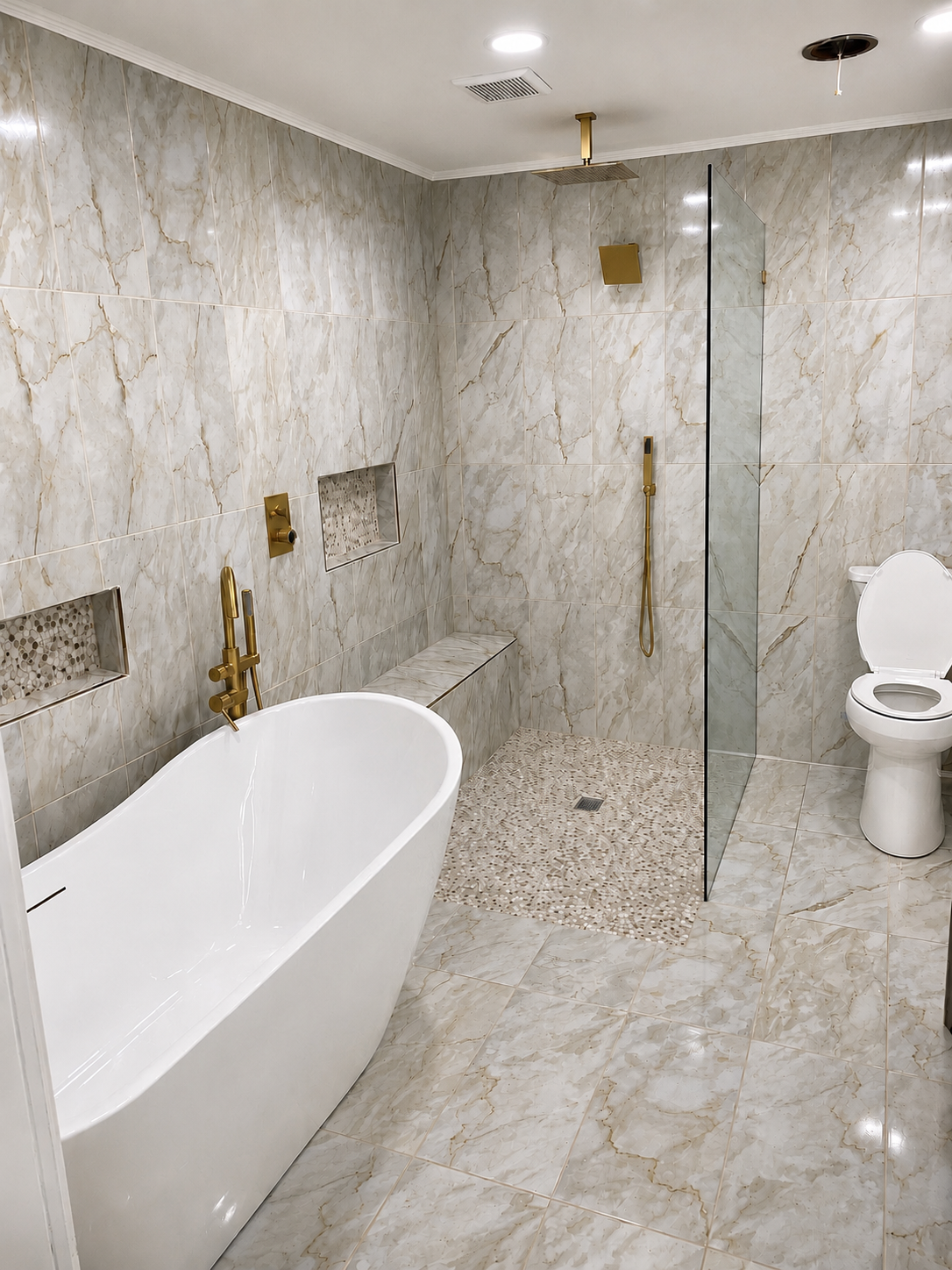 Luxury bathroom with book-matched marble tile, freestanding soaking tub, and brushed gold fixtures