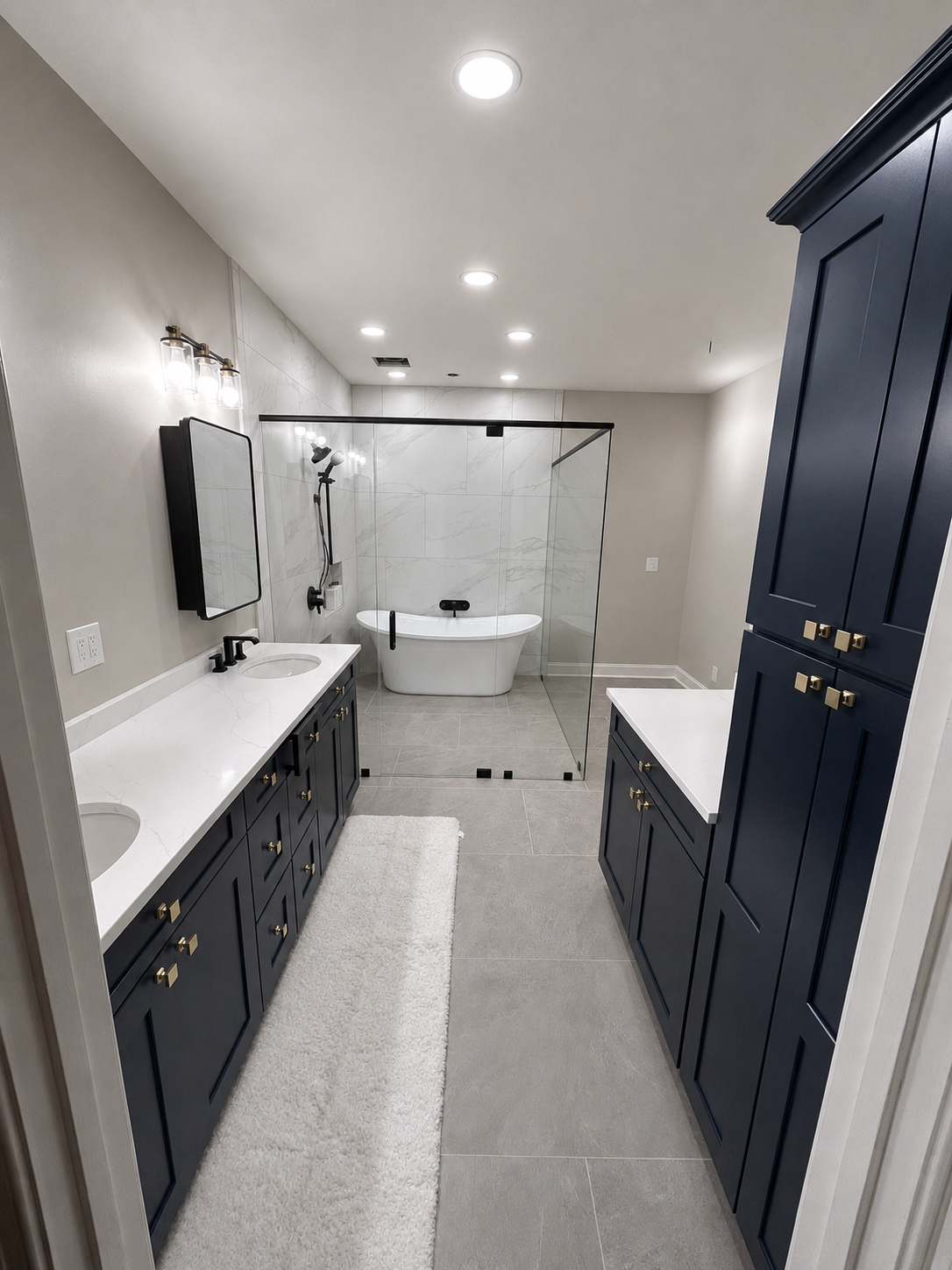 Primary bathroom with navy shaker cabinetry, quartz counters, freestanding tub, and walk-in shower